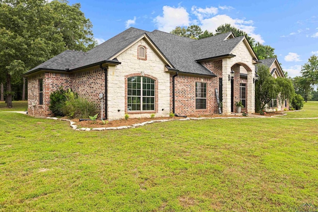 1844 Raven Rd, Diana, TX 75640 - french provincial home with a shingled roof, a front yard, brick siding, and stone siding
