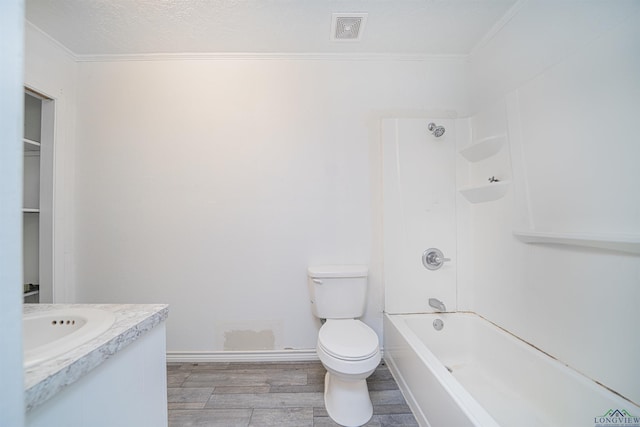 full bathroom with ornamental molding, vanity, shower / washtub combination, hardwood / wood-style floors, and toilet