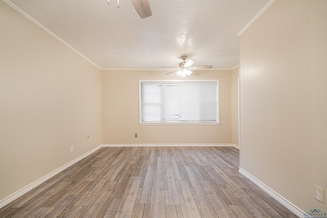 empty room featuring a textured ceiling, ceiling fan, crown molding, and light hardwood / wood-style flooring