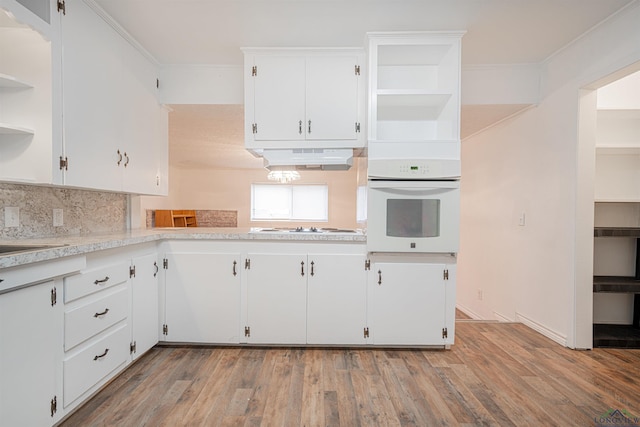 kitchen with white cabinets, white appliances, ventilation hood, and light hardwood / wood-style flooring