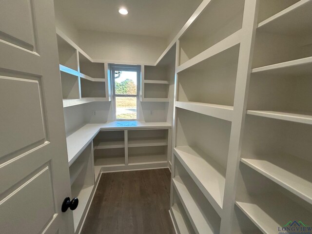 unfurnished living room with ceiling fan, sink, french doors, wood-type flooring, and ornamental molding