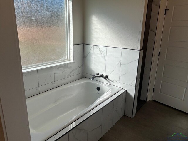 laundry room featuring sink, cabinets, electric dryer hookup, light hardwood / wood-style flooring, and hookup for a washing machine