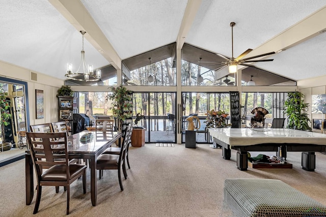 carpeted dining area featuring a textured ceiling, beamed ceiling, and plenty of natural light