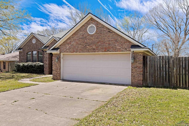 view of front of house featuring brick siding, concrete driveway, a front yard, and fence