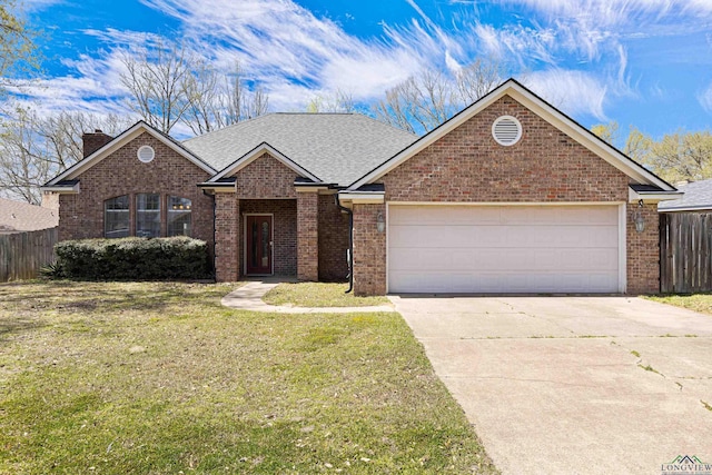view of front of property featuring fence, concrete driveway, a front lawn, a garage, and brick siding