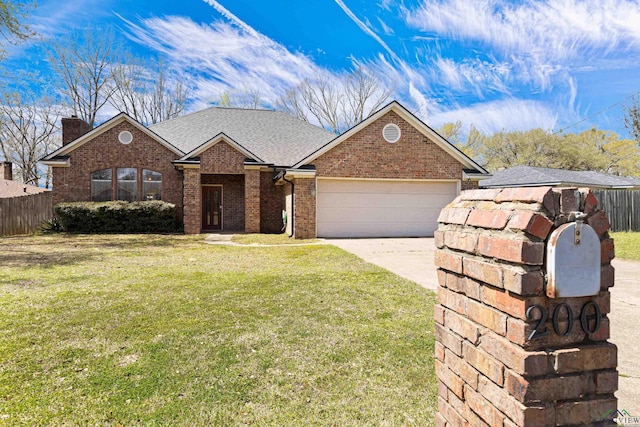 ranch-style house with brick siding, fence, concrete driveway, a front yard, and an attached garage