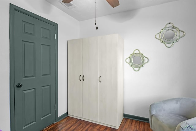 bedroom featuring ceiling fan and dark hardwood / wood-style flooring