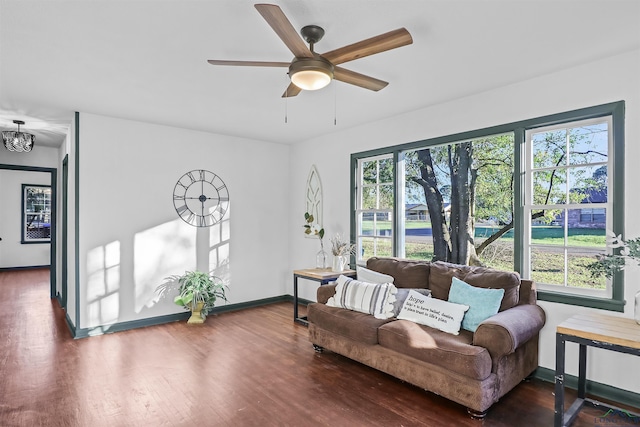 living room with ceiling fan, dark hardwood / wood-style floors, and a wealth of natural light