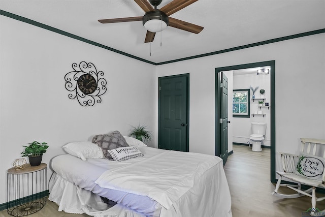 bedroom featuring ensuite bath, ceiling fan, ornamental molding, and hardwood / wood-style flooring