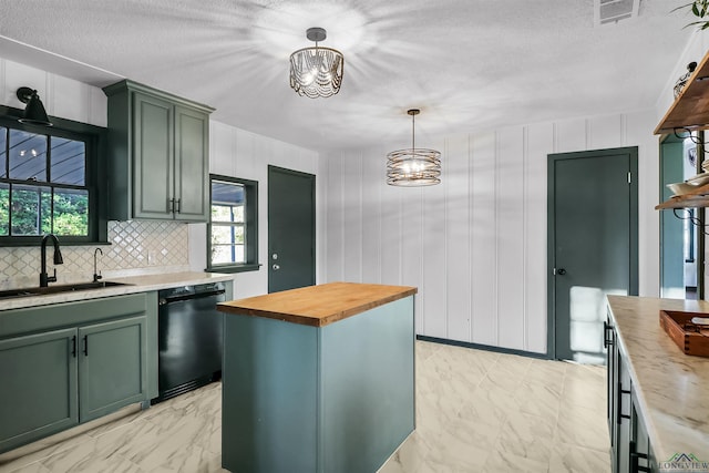 kitchen with wooden counters, sink, pendant lighting, black dishwasher, and a kitchen island