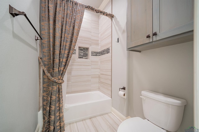 bathroom with shower / tub combo and toilet