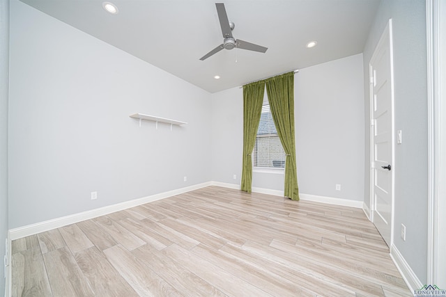 spare room with ceiling fan and light hardwood / wood-style flooring