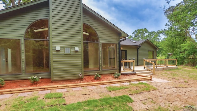 view of home's exterior with a deck