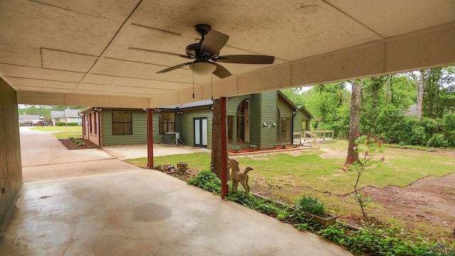 view of patio / terrace featuring a ceiling fan and central AC unit