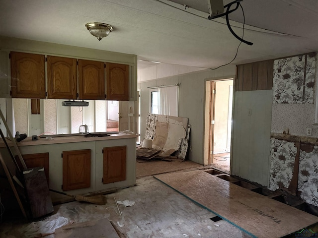 4604 Skyline Dr, Chandler, TX 75758 - kitchen with brown cabinets and a peninsula