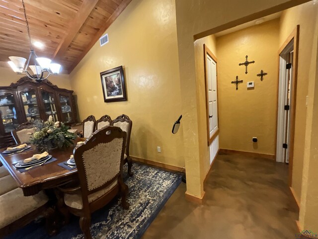 dining space featuring a chandelier, lofted ceiling with beams, and wooden ceiling