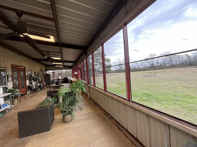 sunroom featuring a rural view