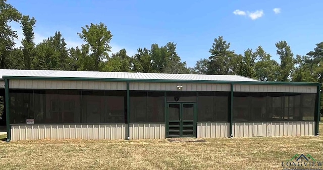 exterior space featuring a sunroom