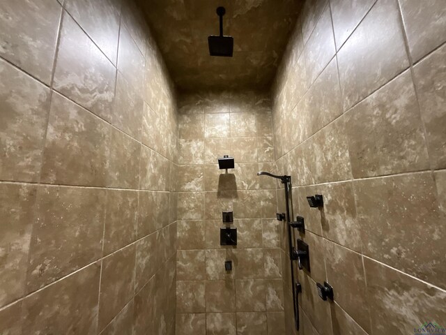 room details with a tile shower