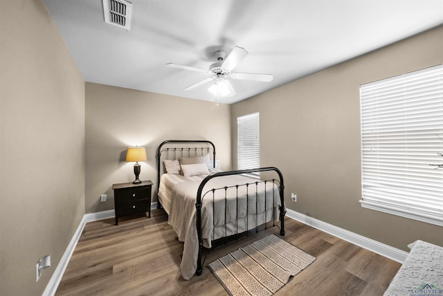 bedroom featuring ceiling fan and hardwood / wood-style flooring