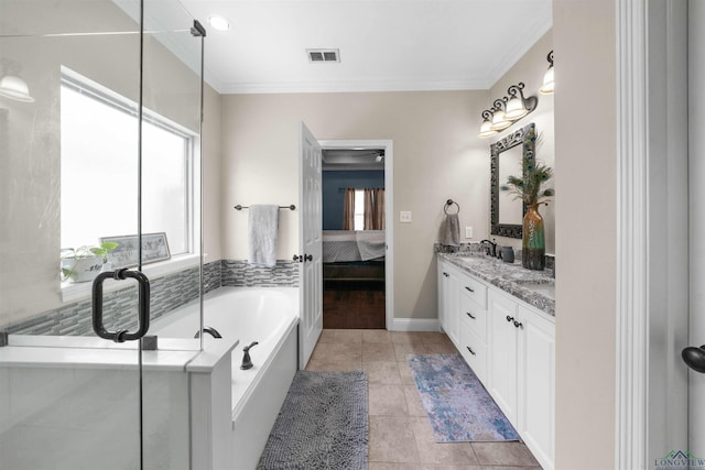 bathroom featuring a tub to relax in, tile patterned floors, and plenty of natural light