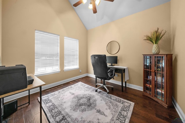 home office with high vaulted ceiling, ceiling fan, and dark wood-type flooring