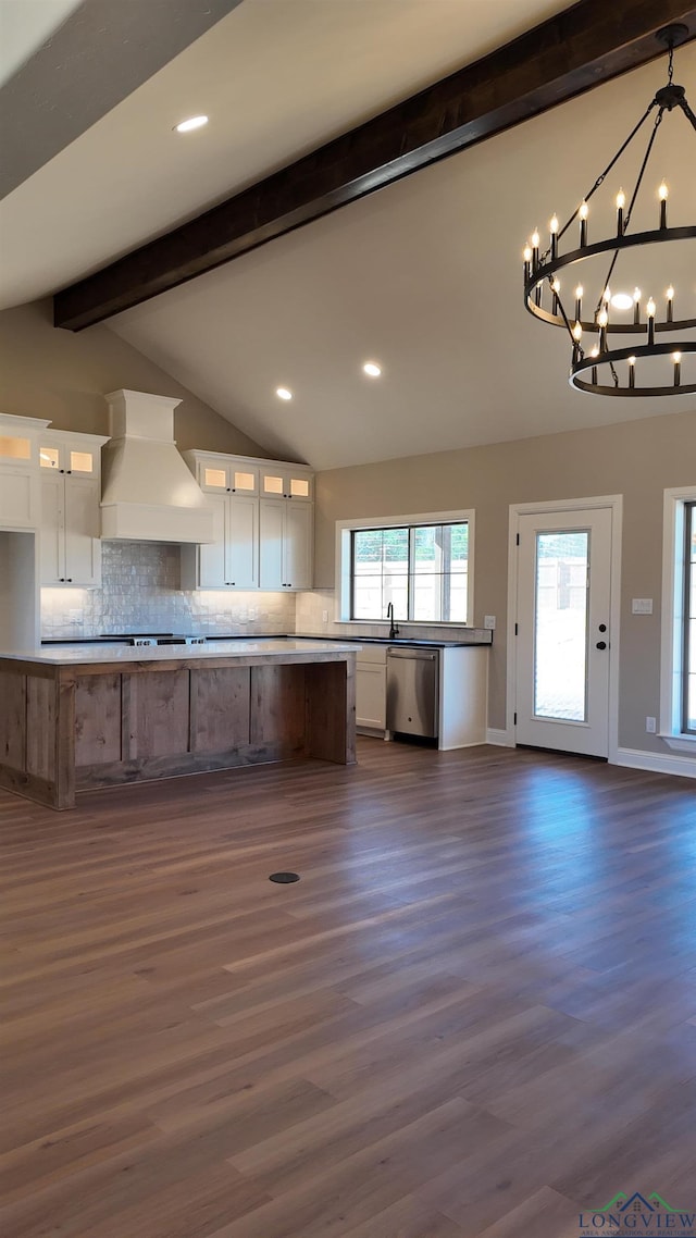 kitchen featuring vaulted ceiling with beams, custom exhaust hood, white cabinets, and dishwasher