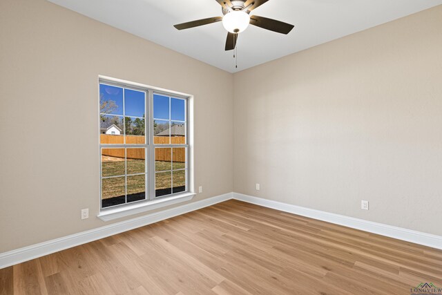 169 Andres Ln, Kilgore, TX 75662 - spare room featuring a ceiling fan, baseboards, and light wood-type flooring