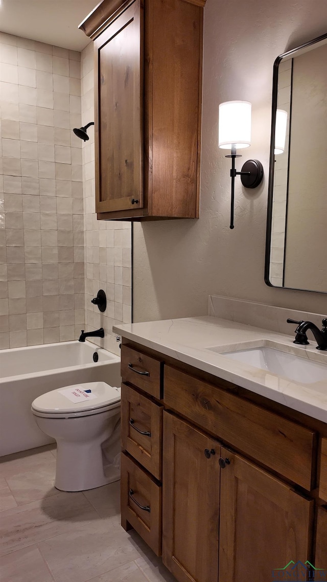 full bath featuring bathing tub / shower combination, toilet, and vanity