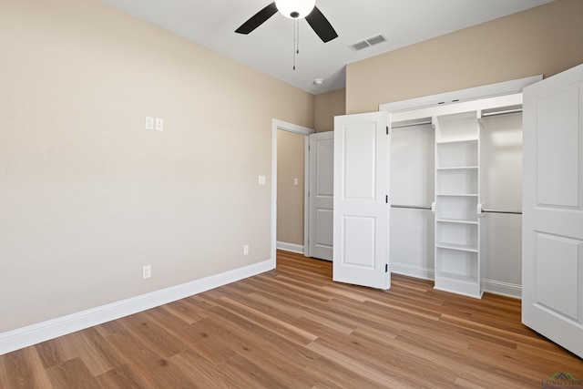 169 Andres Ln, Kilgore, TX 75662 - unfurnished bedroom with light wood-type flooring, baseboards, visible vents, a ceiling fan, and a closet