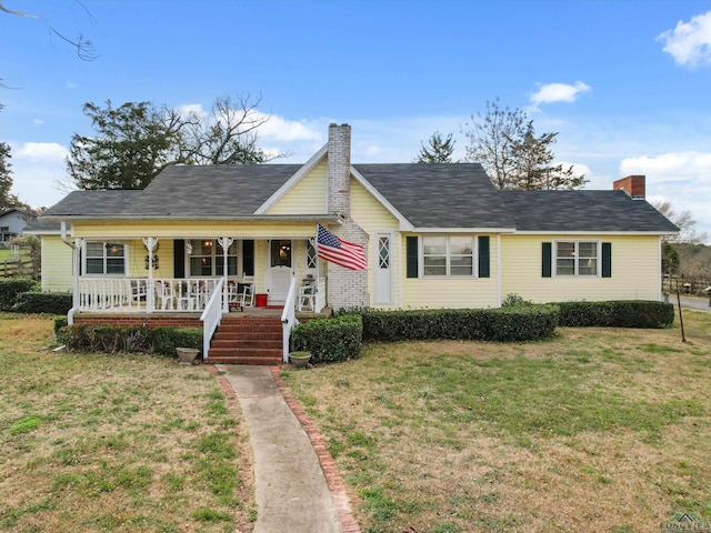 view of front of home with a porch and a front lawn