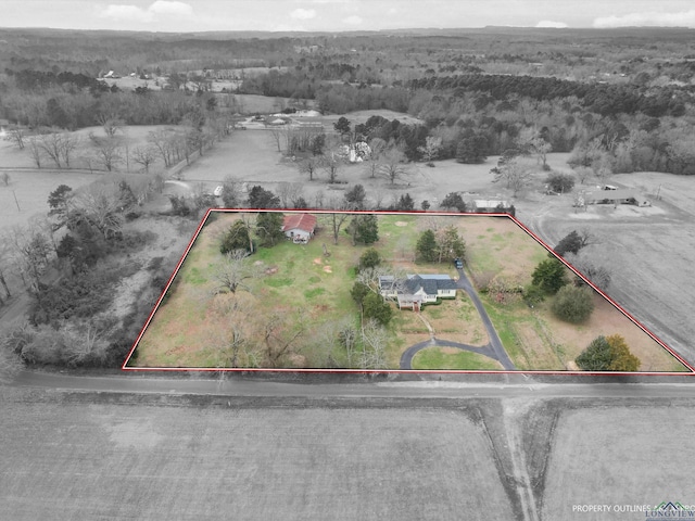 birds eye view of property with a rural view