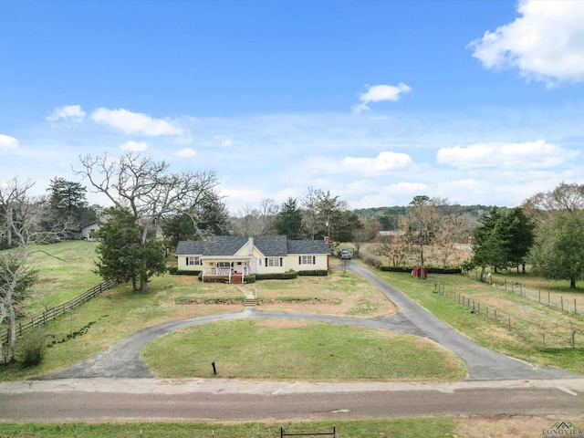 birds eye view of property with a rural view