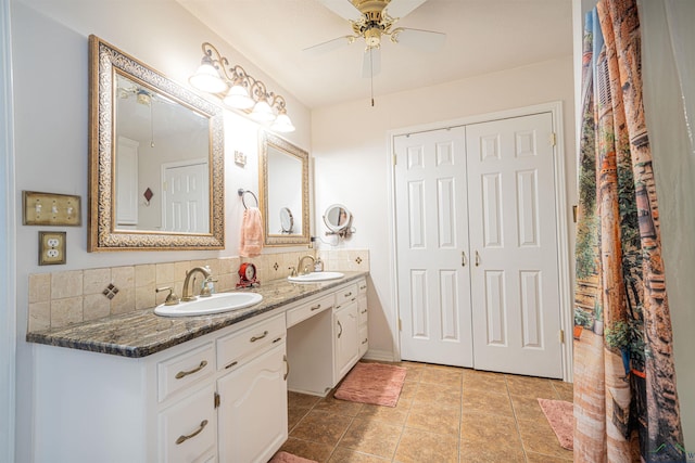 bathroom with ceiling fan, tile patterned floors, backsplash, and vanity