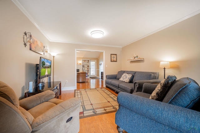 living room featuring crown molding and light wood-type flooring