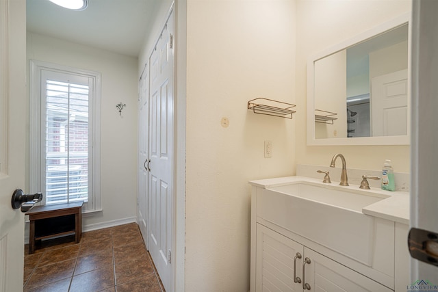 bathroom featuring a healthy amount of sunlight and vanity