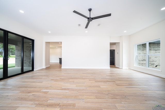 unfurnished room with light hardwood / wood-style flooring and ceiling fan