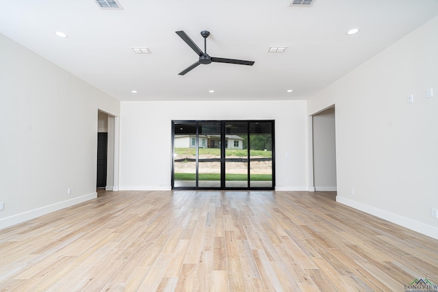 unfurnished room with light wood-type flooring and ceiling fan