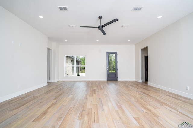 empty room featuring light hardwood / wood-style floors and ceiling fan