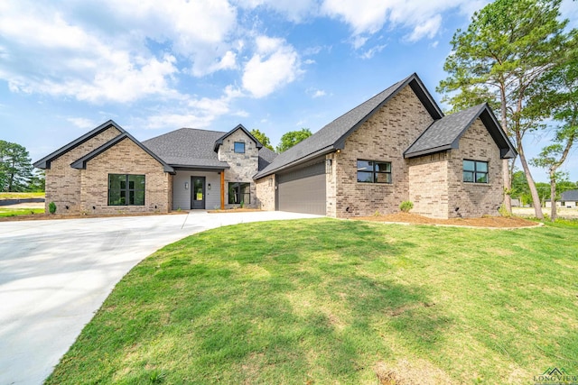 view of front of home featuring a garage and a front lawn