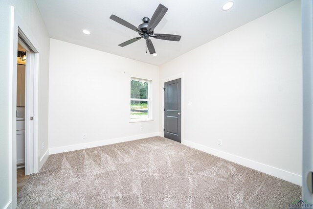 unfurnished bedroom with carpet and ceiling fan