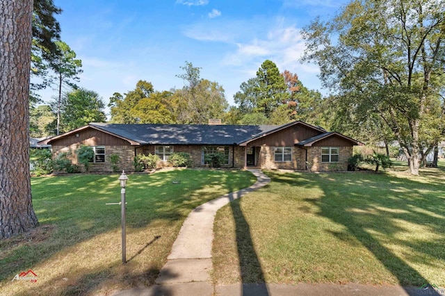 single story home featuring a front yard