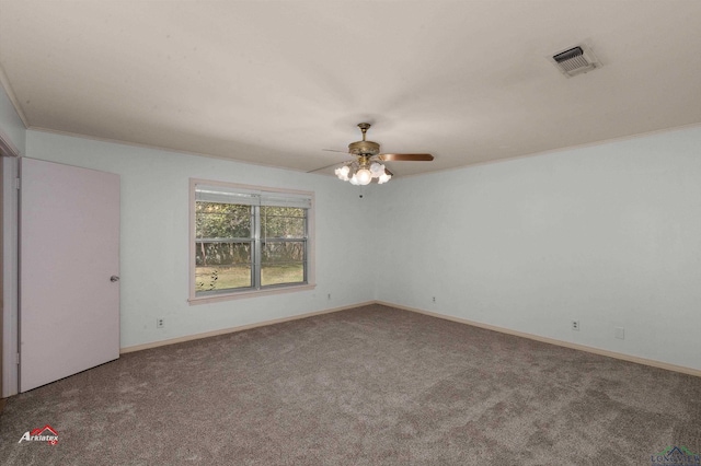 carpeted spare room featuring ceiling fan and ornamental molding