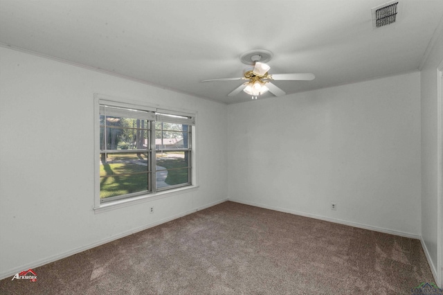 empty room with carpet flooring, ceiling fan, and ornamental molding