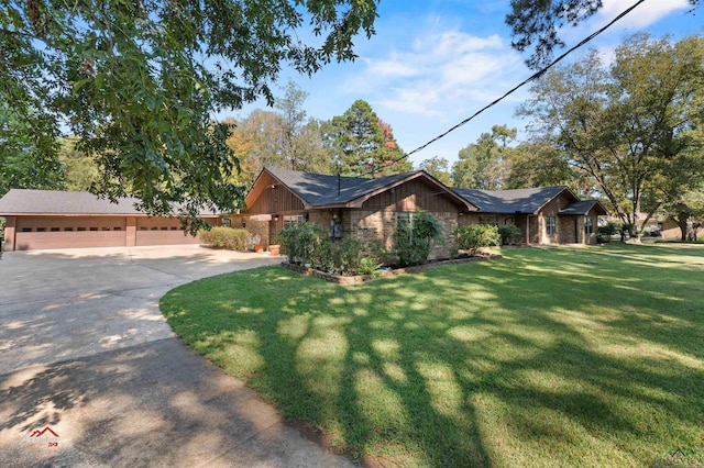 ranch-style home featuring a front lawn and a garage