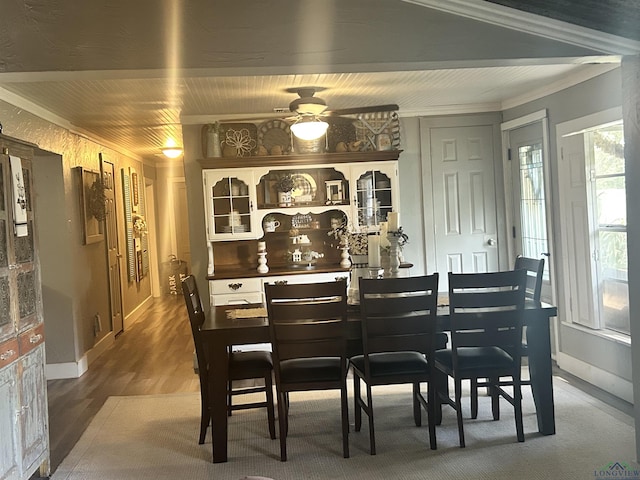 dining space featuring hardwood / wood-style floors, ceiling fan, and crown molding