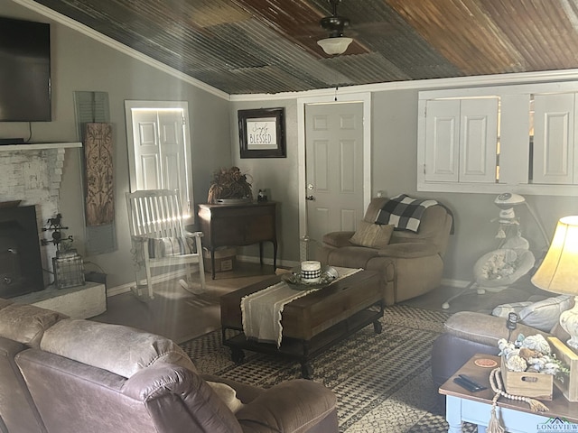 living room featuring ceiling fan, crown molding, wood ceiling, and vaulted ceiling