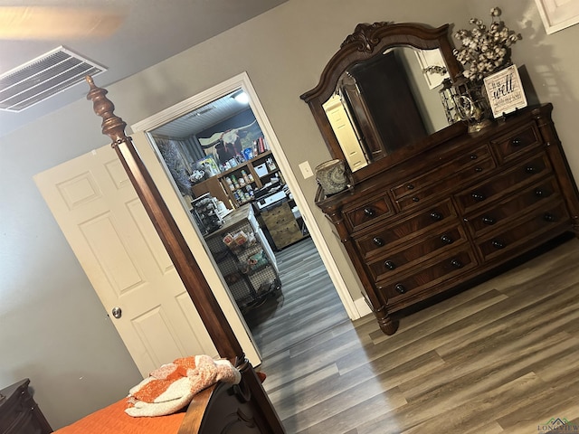 bedroom featuring dark wood-type flooring