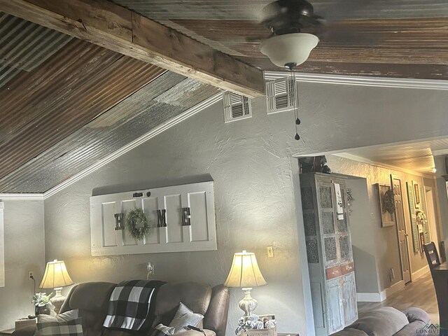 living room with lofted ceiling with beams, crown molding, ceiling fan, and wood ceiling