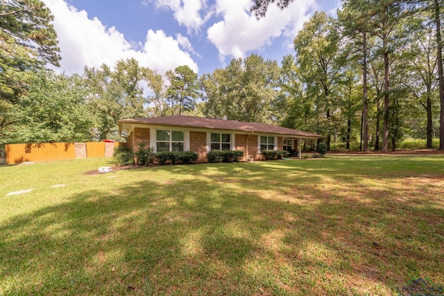 ranch-style house featuring a front lawn